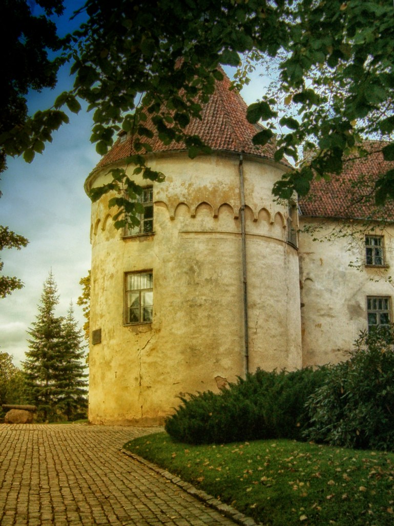 Jaunpils Castle in late afternoon sunlight.